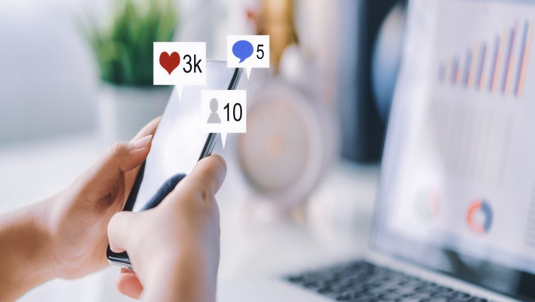 Hand using smart phone with Social media concept